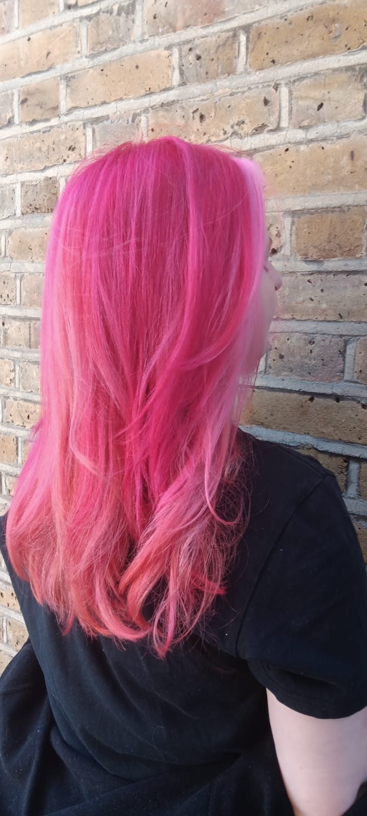 Vibrant pink hair colour with soft fade